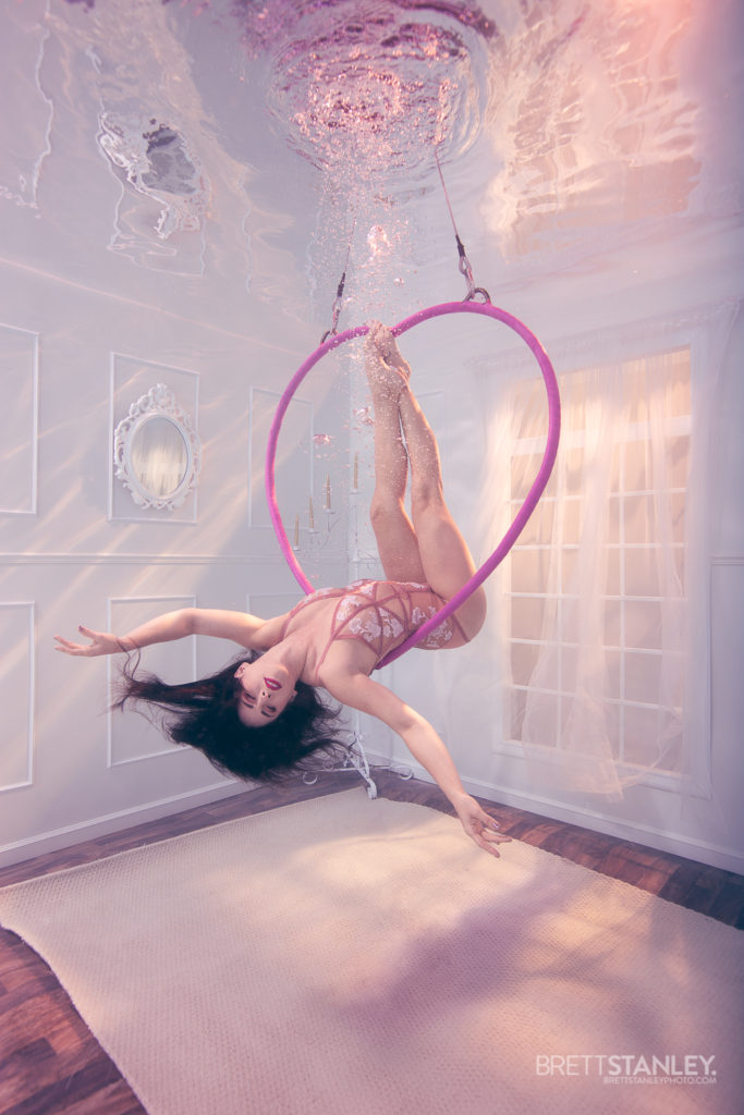 Underwater room or set showing a model posing for underwater photography