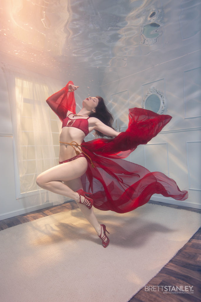 Underwater room or set showing a model posing for underwater photography