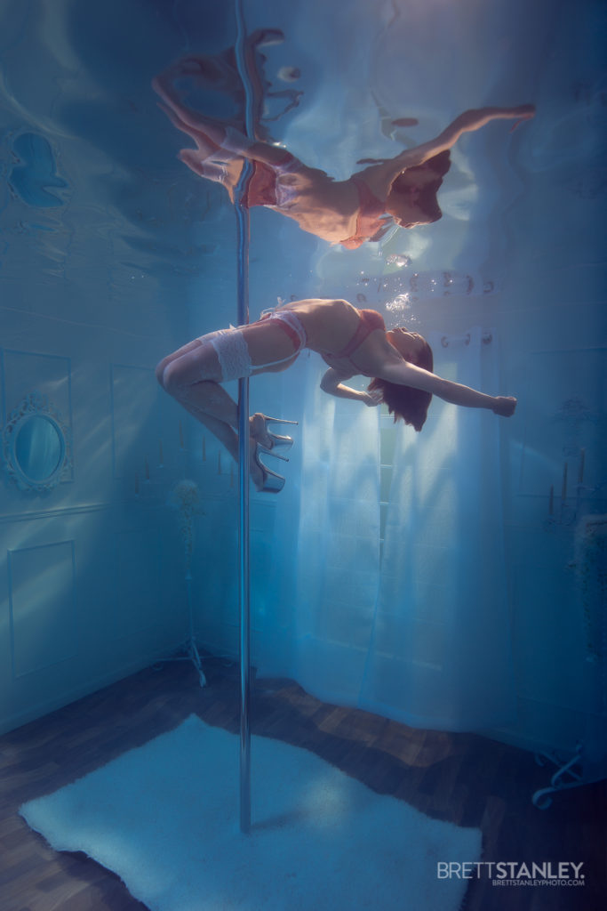 Underwater room or set showing a model posing for underwater photography